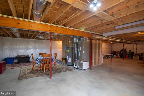 a dining room with stainless steel appliances kitchen island granite countertop furniture and a dining table