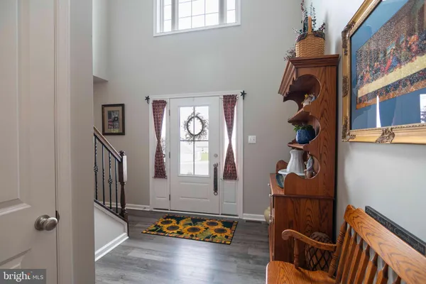 a view of an entryway with wooden floor