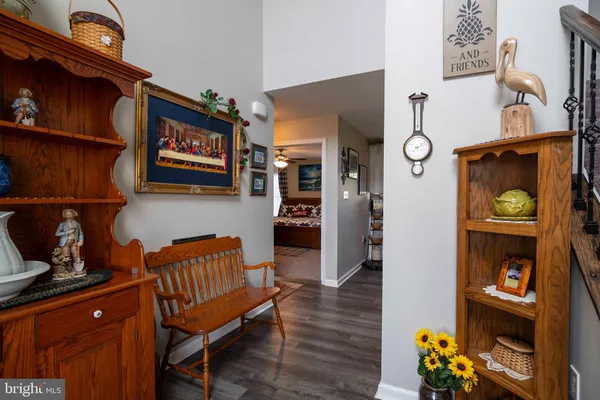 a living room with furniture and a book shelf