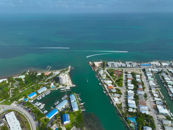 a balcony with chairs and a table