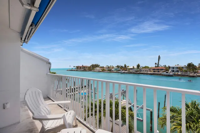 a view of a balcony with chairs