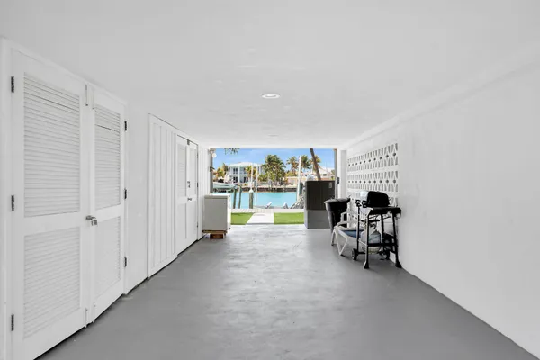 a view of a livingroom with furniture and a window