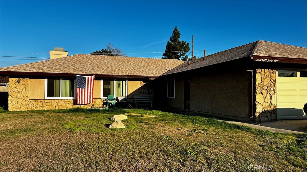 6838 Holbrook Way Riverside, CA 92504 - Photo 1 of 1 a front view of a house with a yard