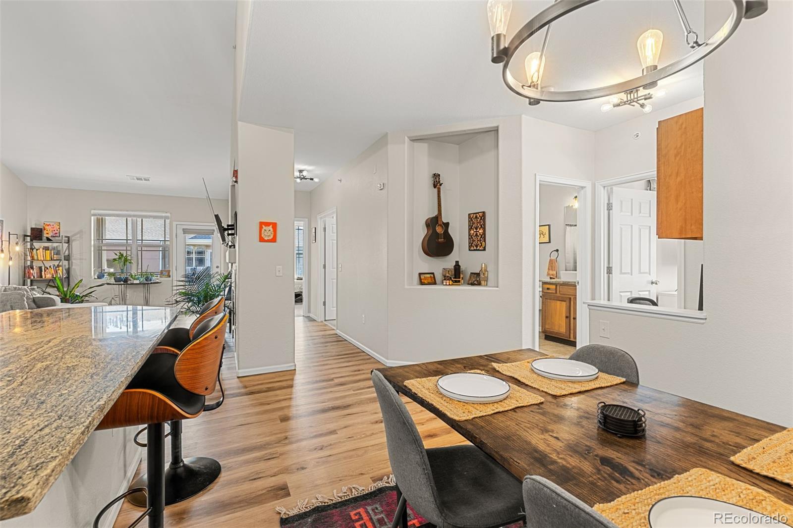 8073 West 51st Place, Unit 303 Arvada, CO 80002 - Photo 19 of 48 a living room with furniture and wooden floor
