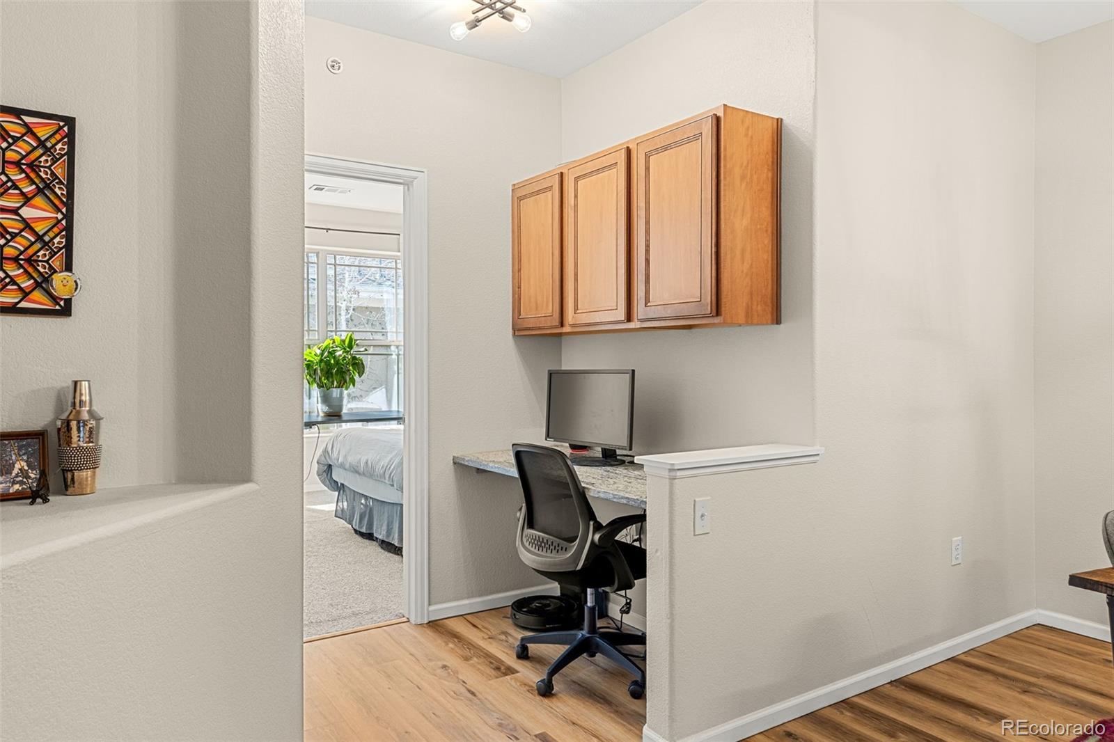 8073 West 51st Place, Unit 303 Arvada, CO 80002 - Photo 21 of 48 a view of workspace with wooden floor windows
