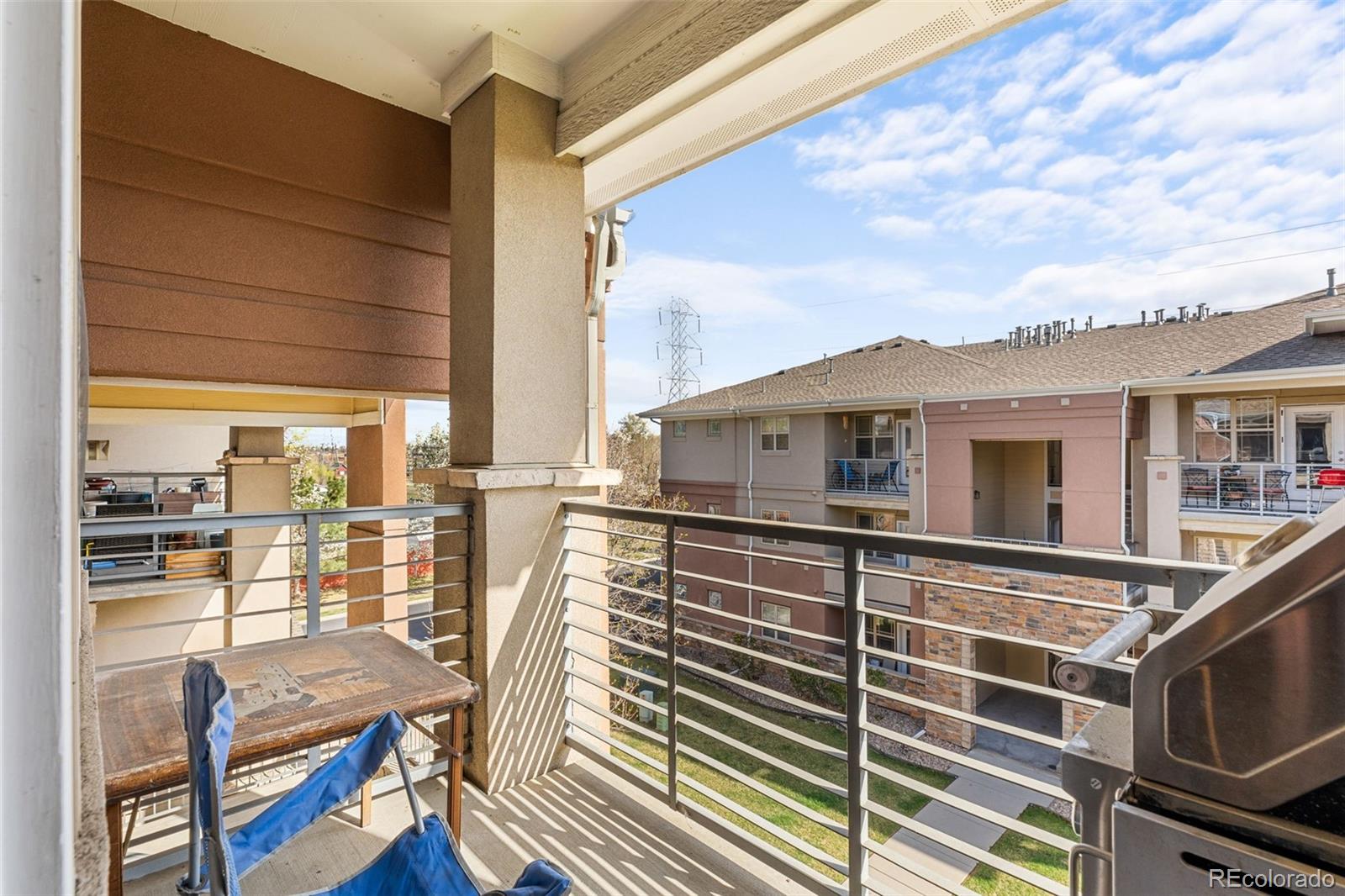 8073 West 51st Place, Unit 303 Arvada, CO 80002 - Photo 22 of 48 a view of a balcony with chairs