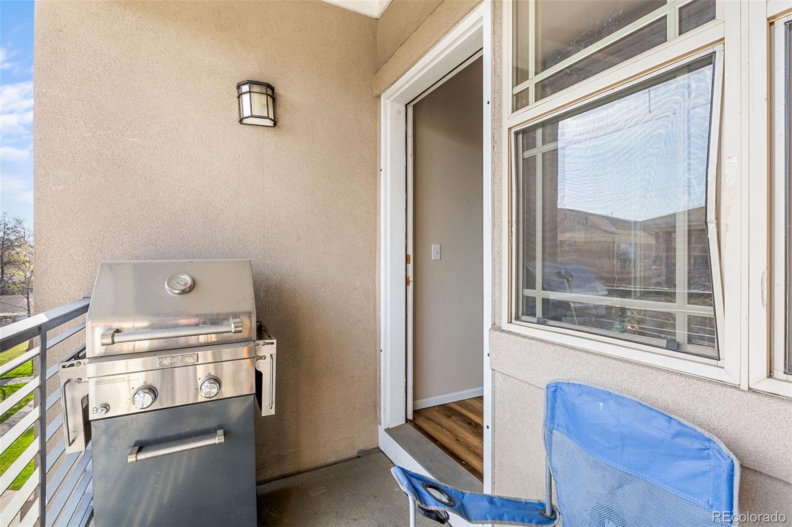 8073 West 51st Place, Unit 303 Arvada, CO 80002 - Photo 23 of 48 a kitchen with a stove and a window