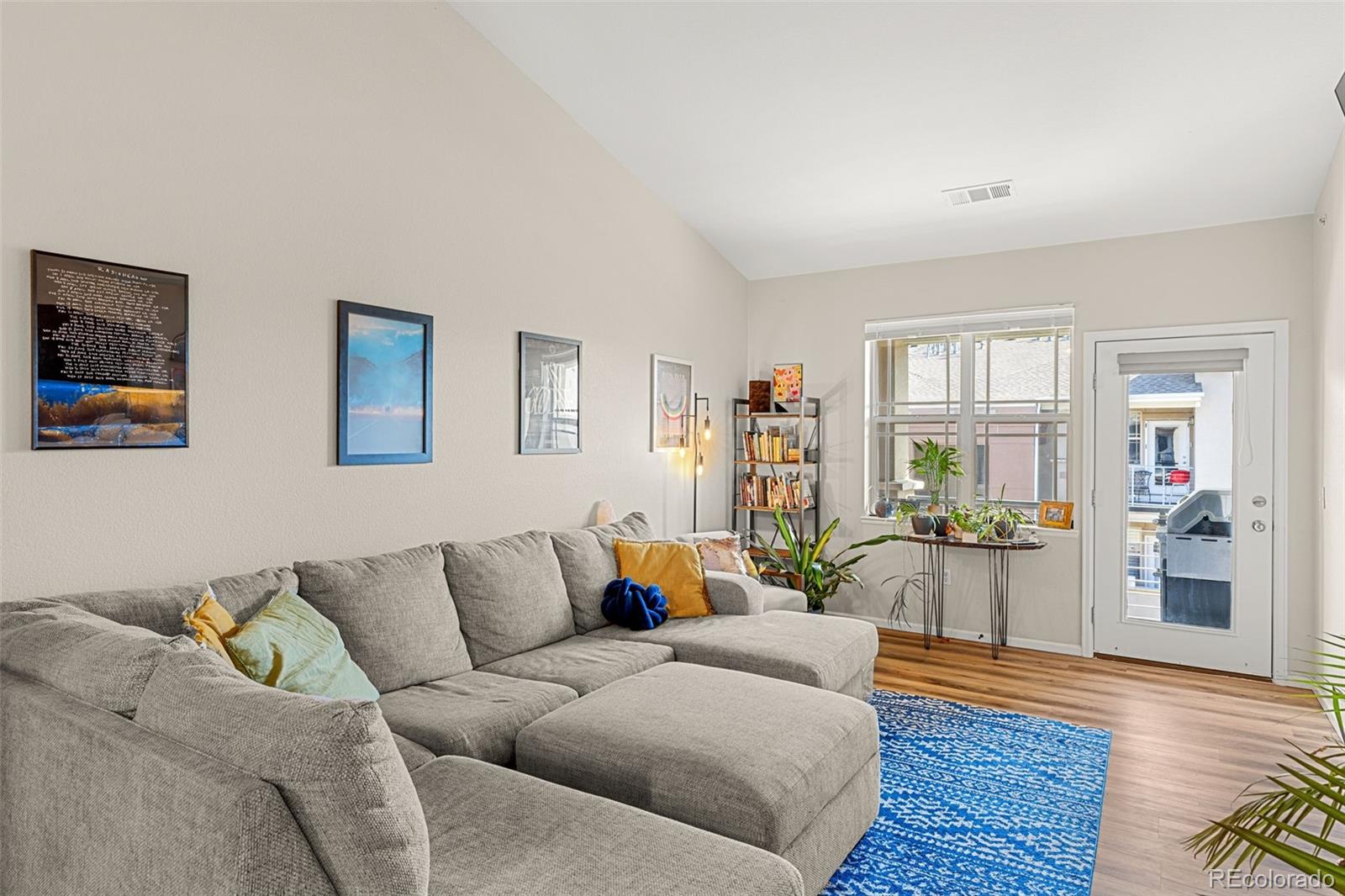8073 West 51st Place, Unit 303 Arvada, CO 80002 - Photo 3 of 48 a living room with furniture and wooden floor