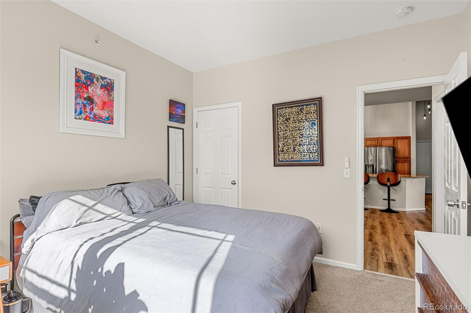 8073 West 51st Place, Unit 303 Arvada, CO 80002 - Photo 40 of 48 a bedroom with a bed and a couch