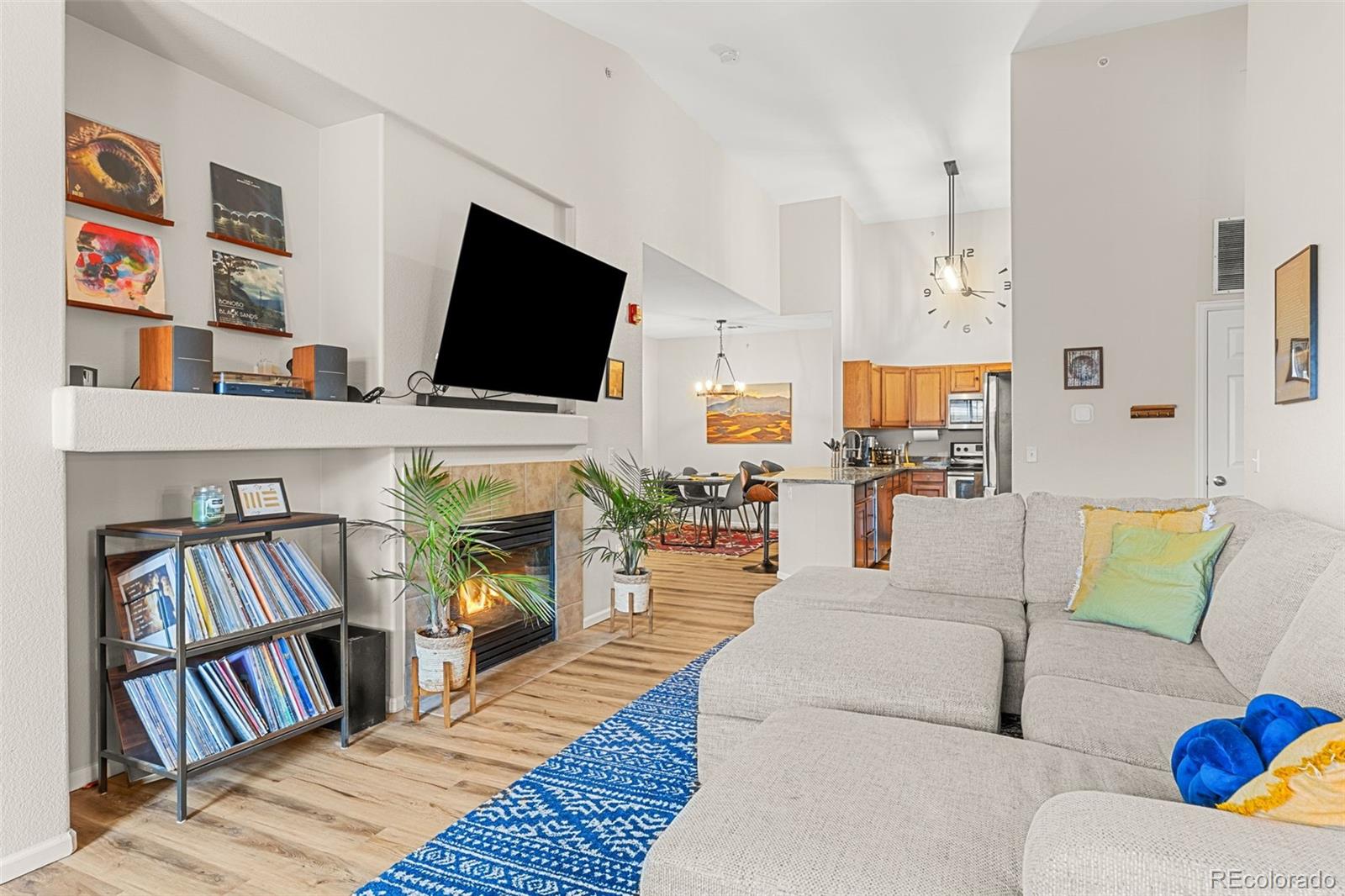 8073 West 51st Place, Unit 303 Arvada, CO 80002 - Photo 4 of 48 a living room with furniture and a fireplace