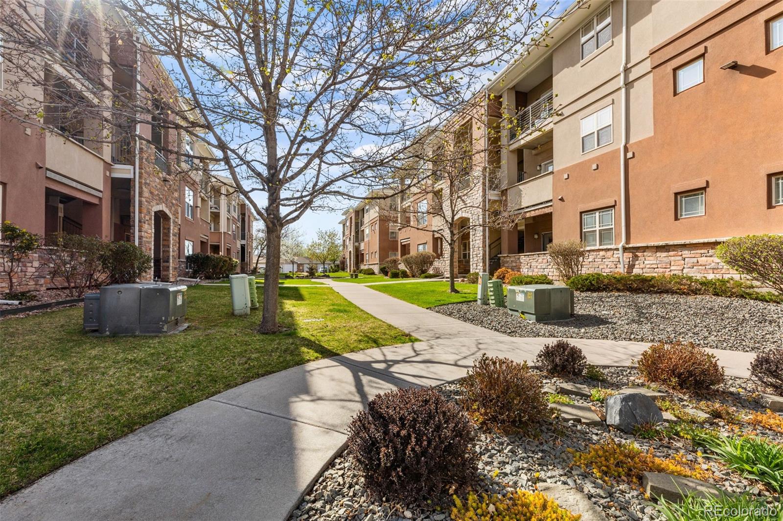8073 West 51st Place, Unit 303 Arvada, CO 80002 - Photo 46 of 48 a view of a house with garden and sitting area