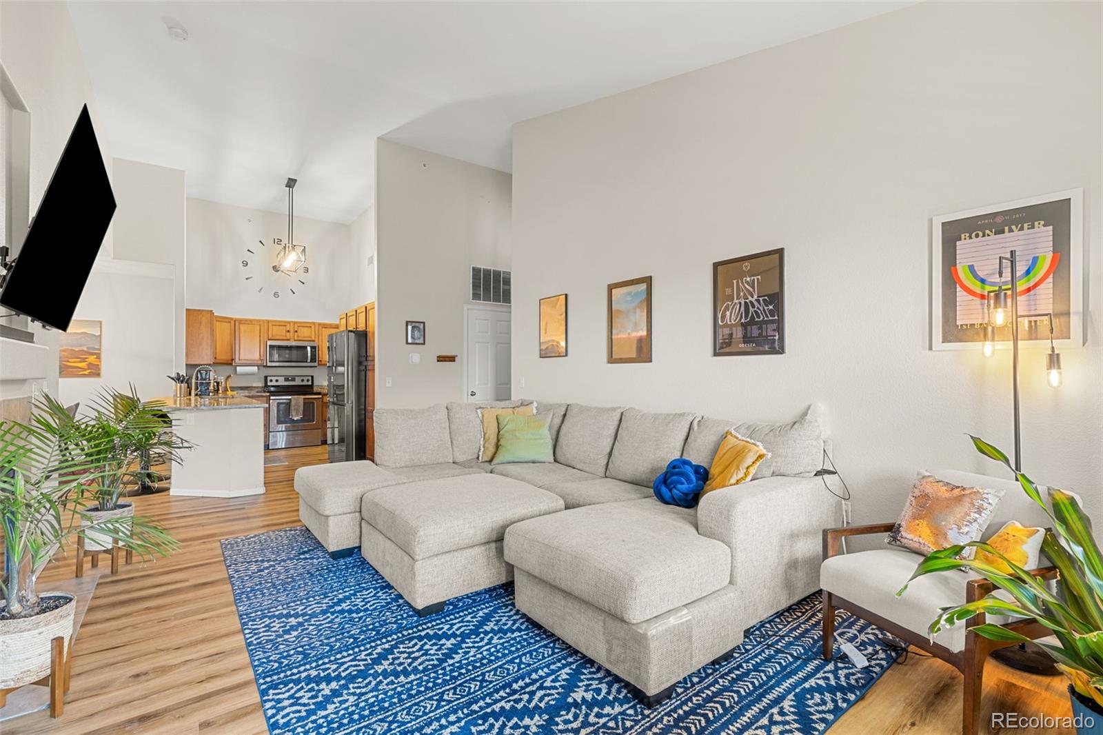 8073 West 51st Place, Unit 303 Arvada, CO 80002 - Photo 5 of 48 a living room with furniture a flat screen tv and a rug