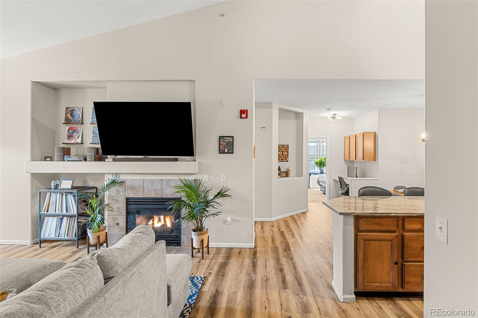 8073 West 51st Place, Unit 303 Arvada, CO 80002 - Photo 8 of 48 a living room with furniture and a flat screen tv