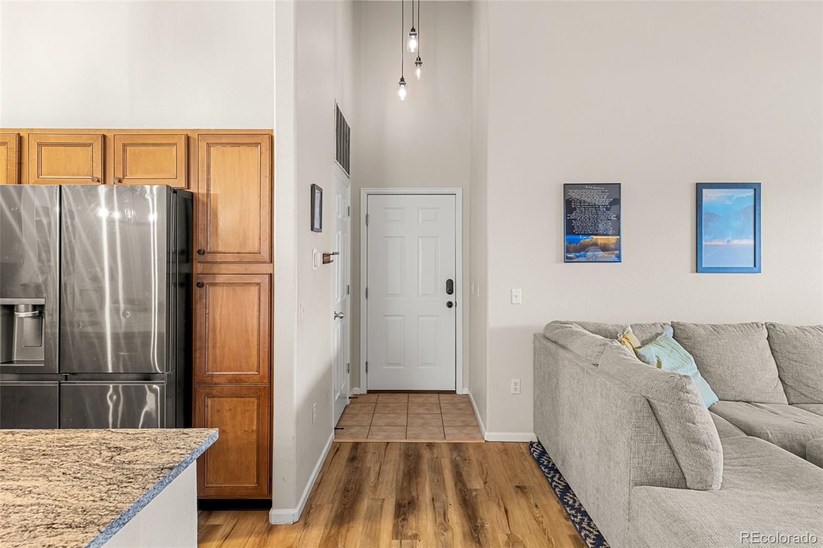 8073 West 51st Place, Unit 303 Arvada, CO 80002 - Photo 9 of 48 a kitchen with stainless steel appliances granite countertop a refrigerator and a stove