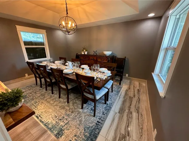a white toilet sitting next to a sink and bathroom