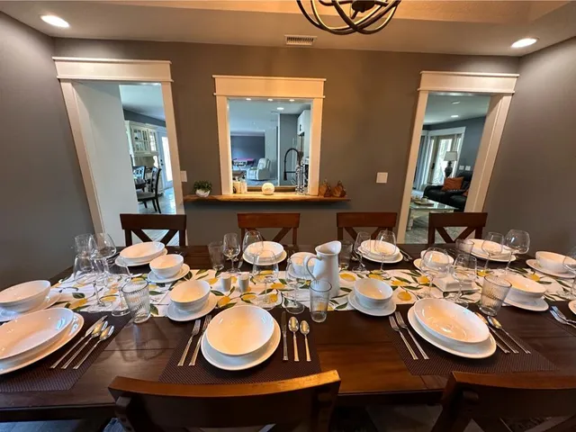 a view of a hallway with wooden floor and entryway