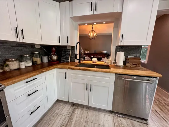 a bathroom with a granite countertop toilet sink and a shower