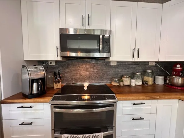 a bed room with a bed and a window