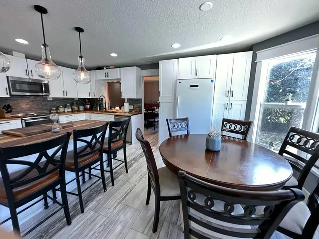 a bed room with a bed and a television