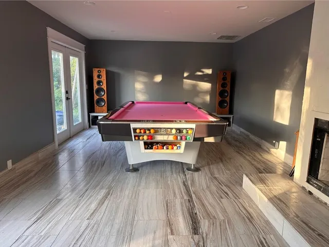 a view of a dining room with furniture and window