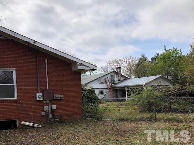 2171 Bud Lipscomb Road Willow Spring, NC 27592 - Photo 2 of 20 a front view of a house with garden