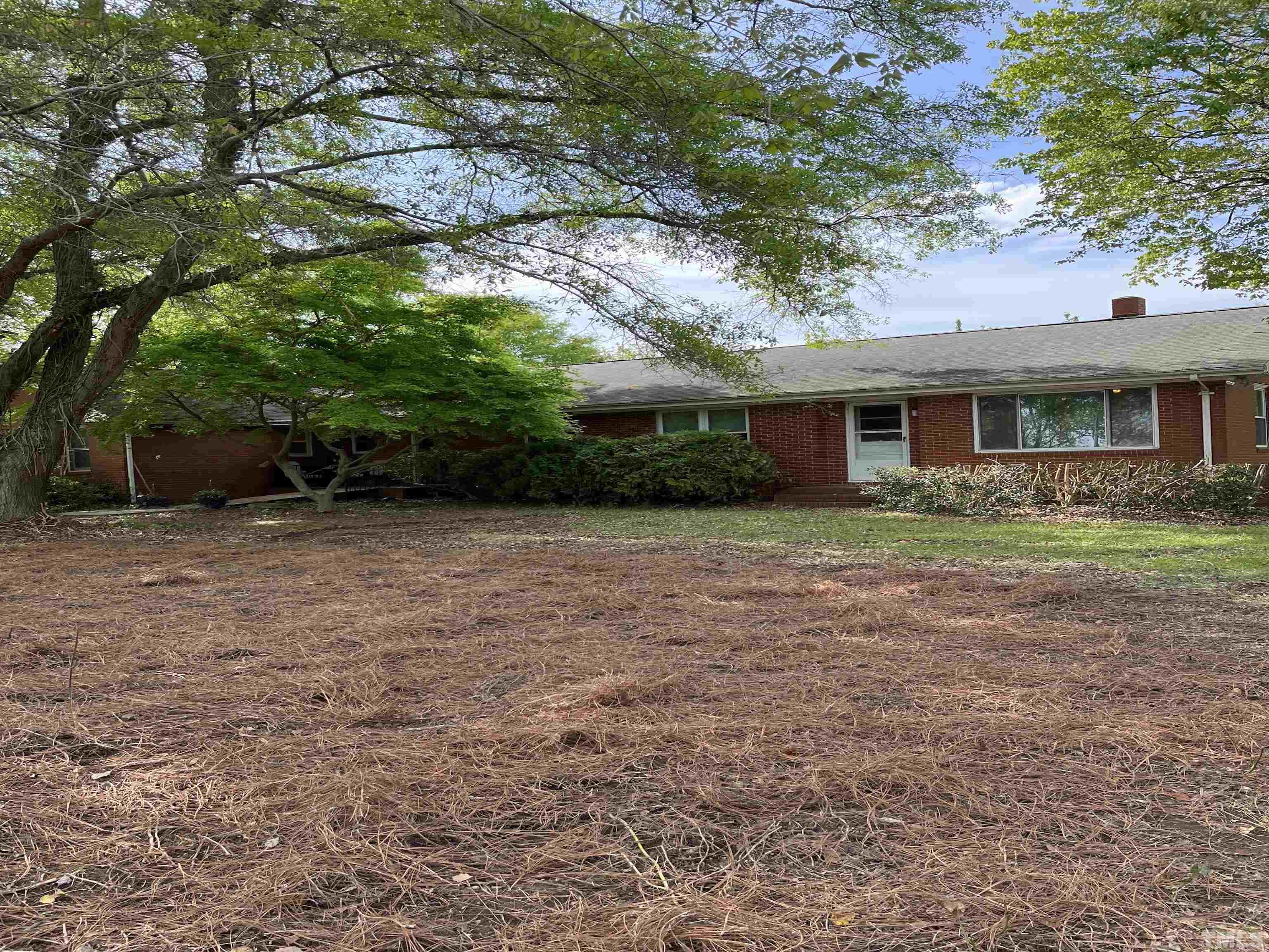 2171 Bud Lipscomb Road Willow Spring, NC 27592 - Photo 9 of 20 a front view of house with yard and green space
