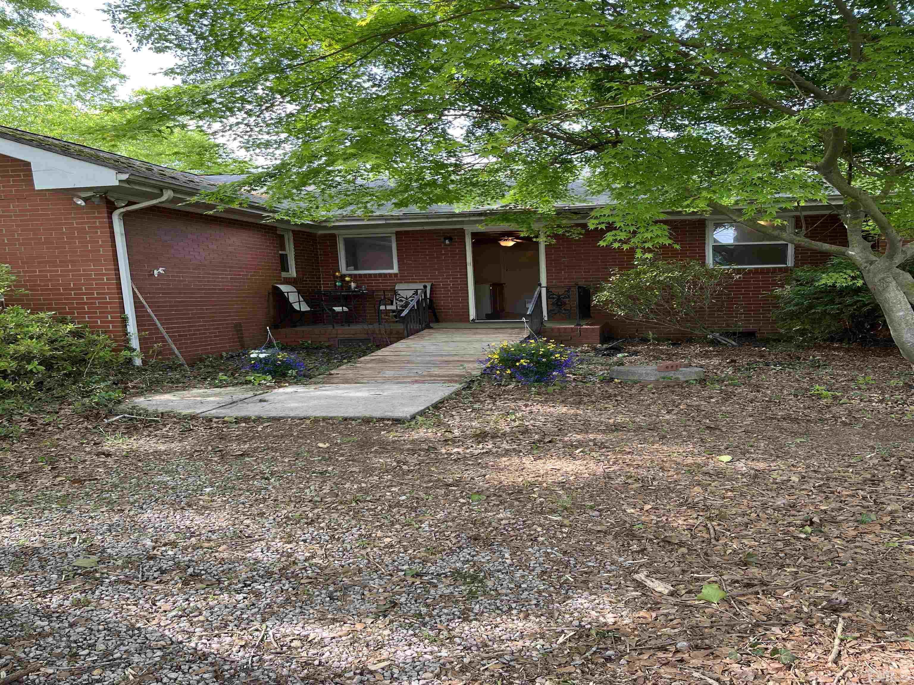 2171 Bud Lipscomb Road Willow Spring, NC 27592 - Photo 10 of 20 a view of a house with backyard and trees