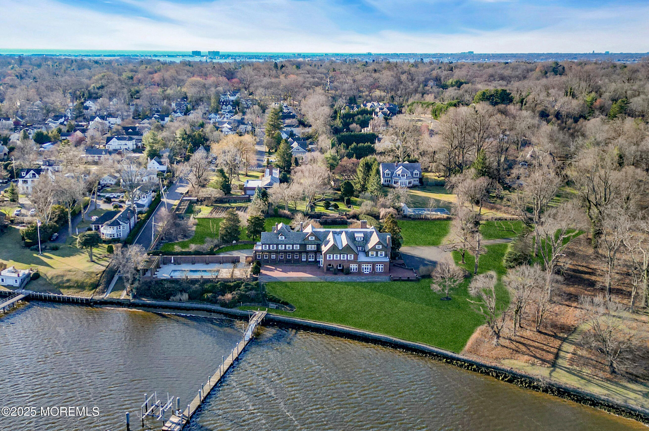 66 A West River Road Rumson, NJ 07760 - Photo 33 of 34 an aerial view of a house with a garden and lake view