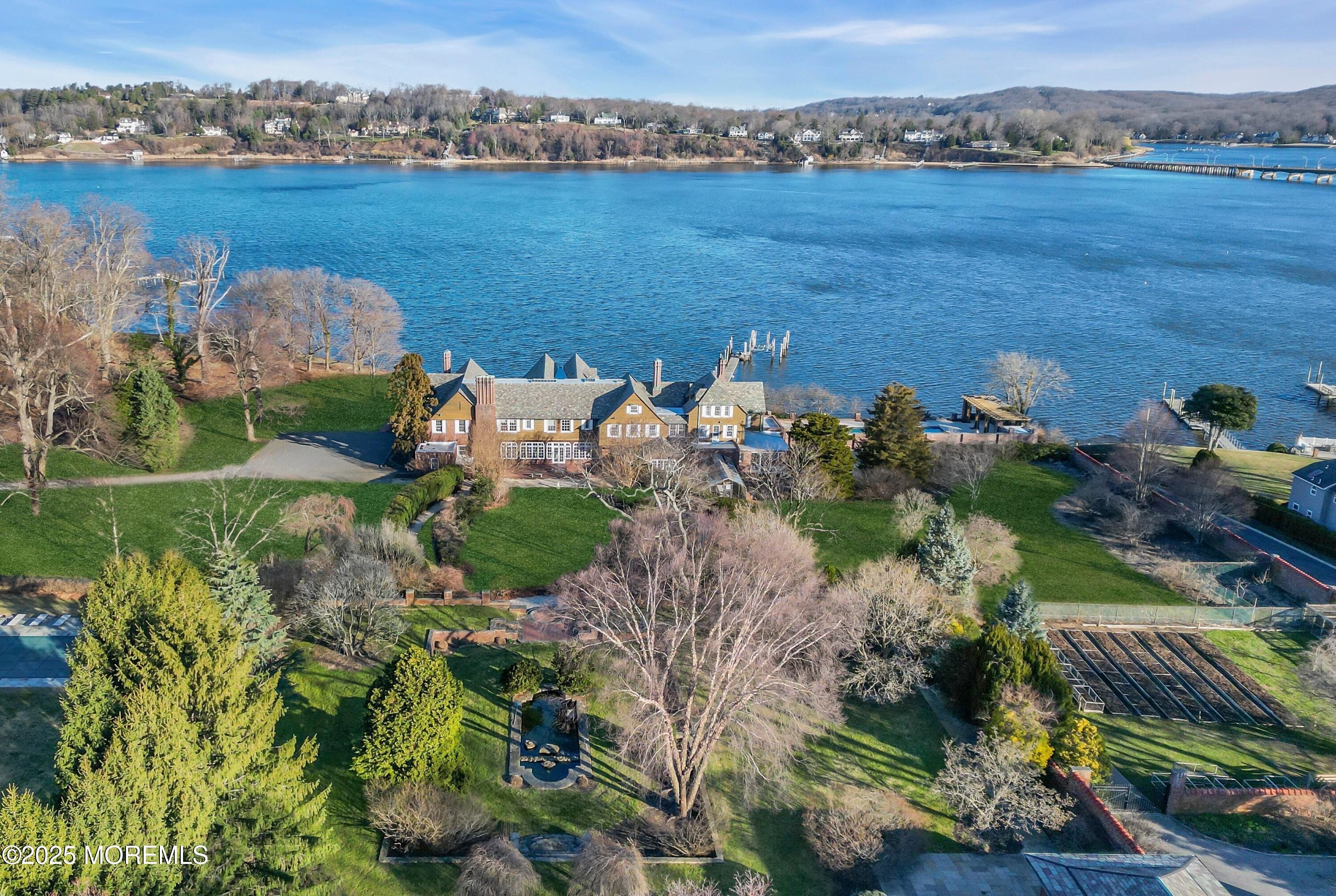 66 A West River Road Rumson, NJ 07760 - Photo 8 of 34 an aerial view of a house with a lake view