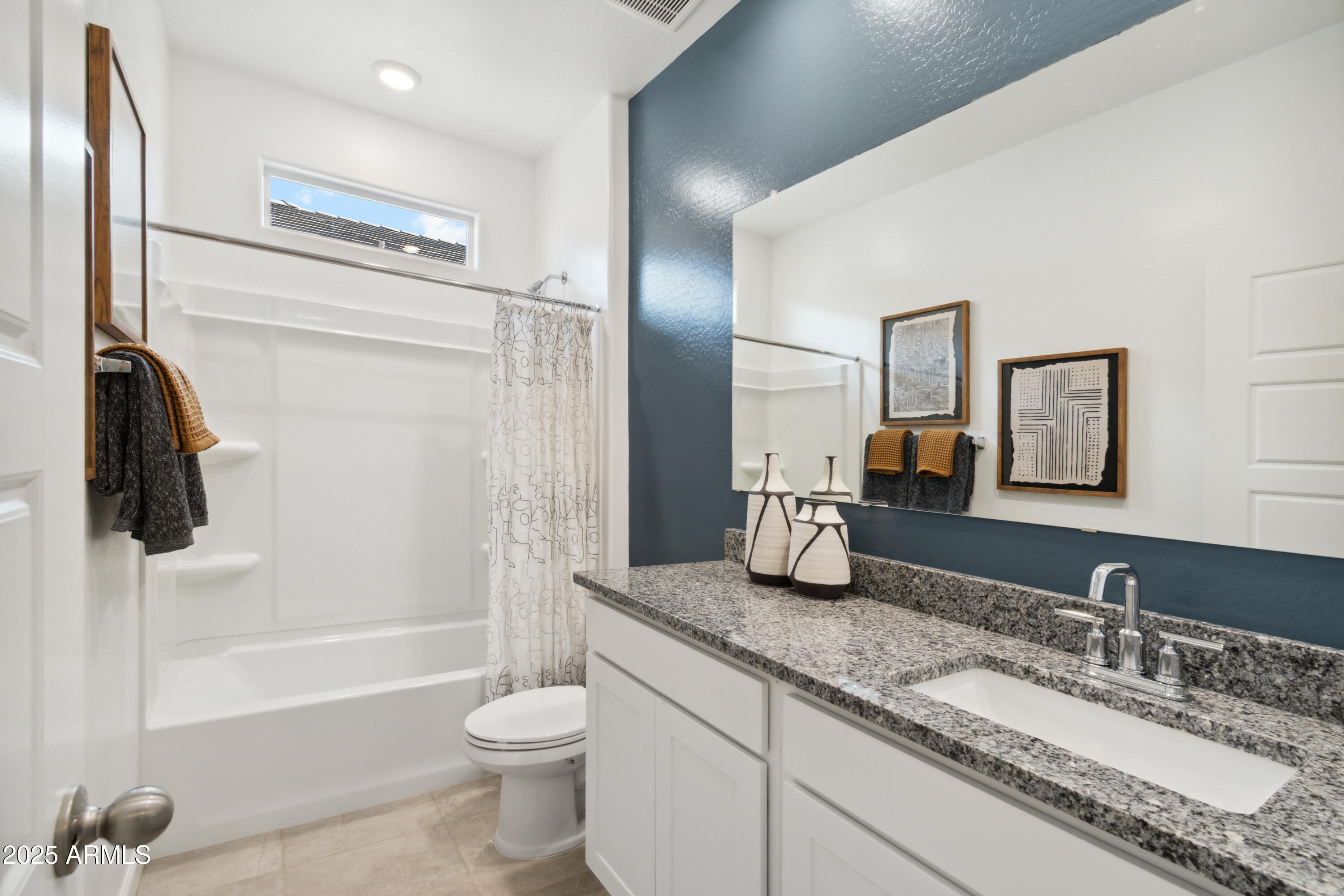2284 West Solstice Avenue Apache Junction, AZ 85120 - Photo 18 of 21 a bathroom with a granite countertop sink toilet and shower
