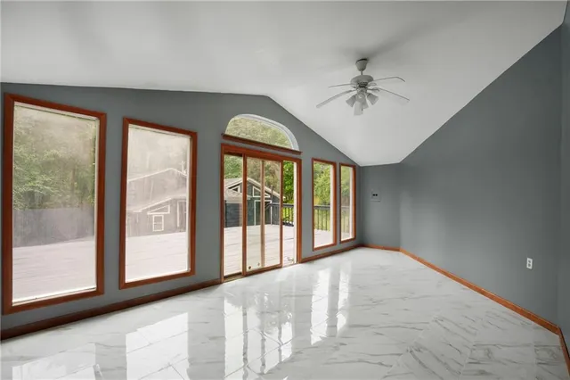 a view of an empty room with a window