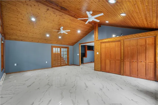 a view of an empty room with windows