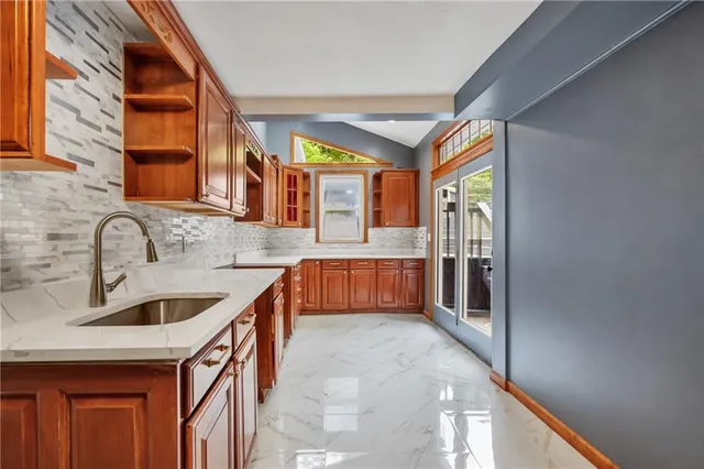 a bathroom with a tub a sink and mirror