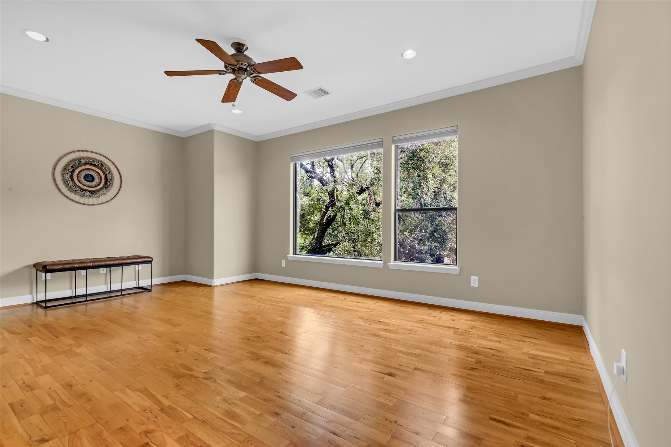 2413 Ralph Street, Unit 2 Houston, TX 77006 - Photo 12 of 26 wooden floor in a empty room with a window
