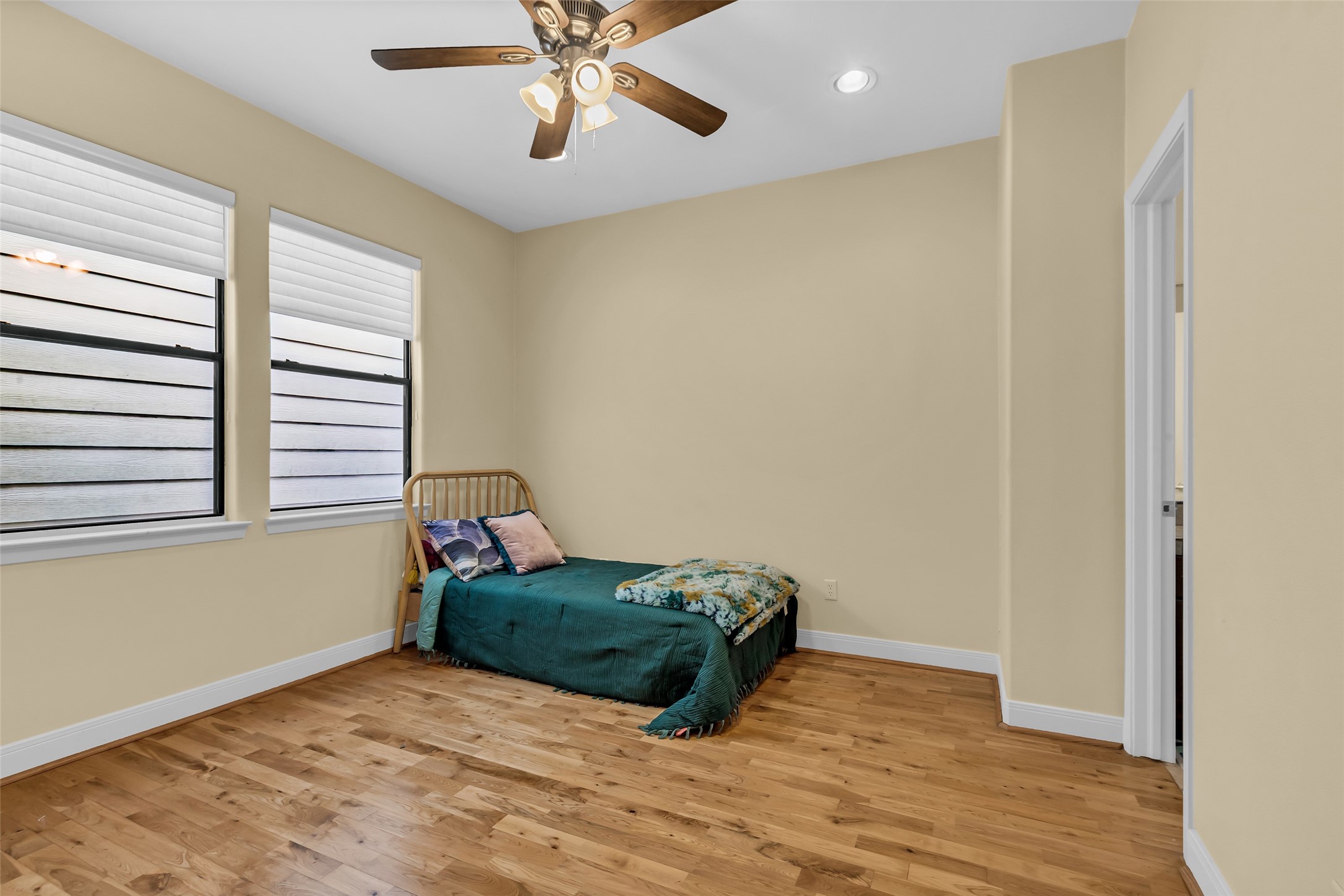 2413 Ralph Street, Unit 2 Houston, TX 77006 - Photo 16 of 26 a room with a bed and a chandelier