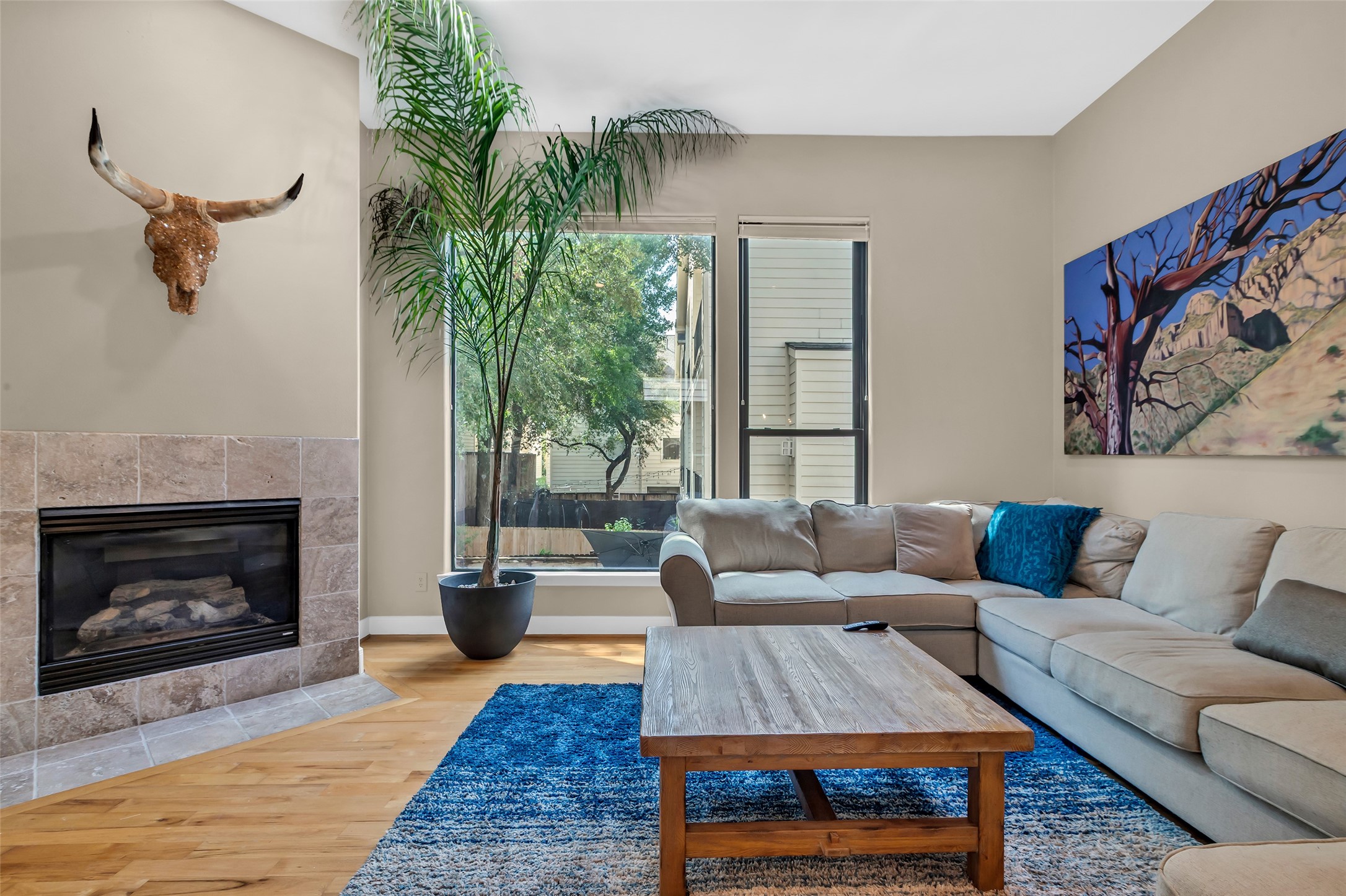 2413 Ralph Street, Unit 2 Houston, TX 77006 - Photo 3 of 26 a living room with furniture a rug and a fireplace