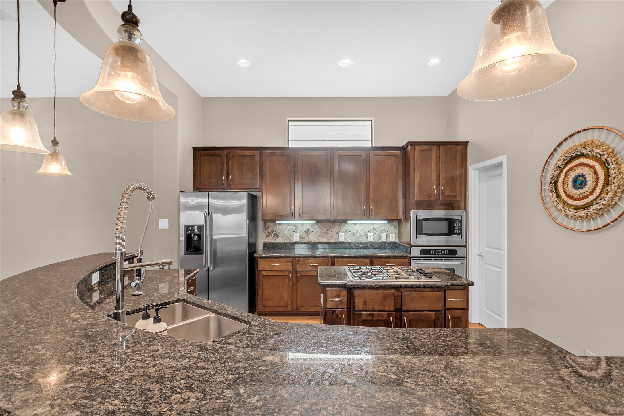 2413 Ralph Street, Unit 2 Houston, TX 77006 - Photo 7 of 26 a kitchen with stainless steel appliances granite countertop a refrigerator a stove and a sink with granite countertops