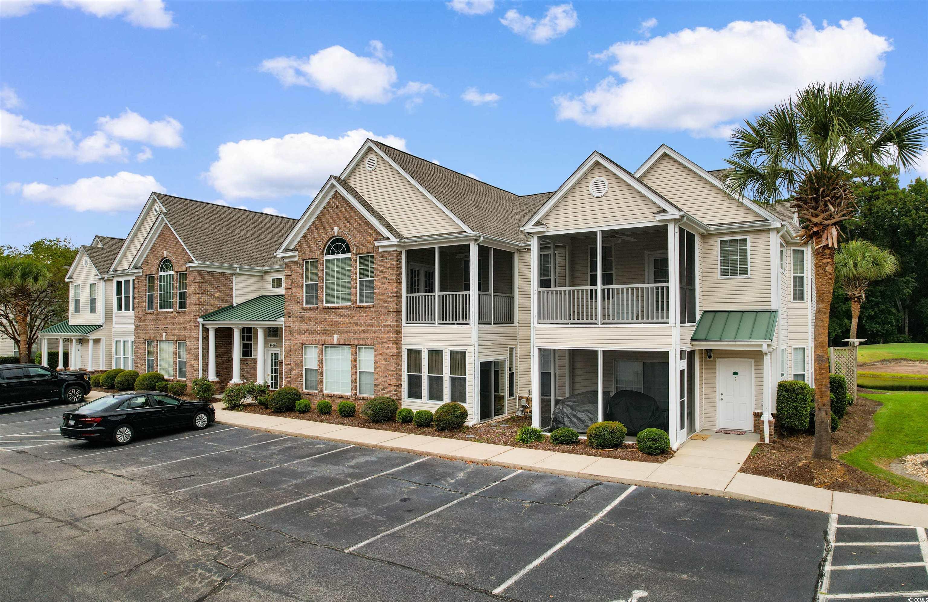 4430 Lady Banks Lane, Unit A2 Murrells Inlet, SC 29576 - Photo 2 of 31 View of property featuring uncovered parking