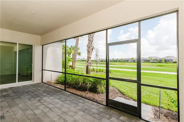 a view of a room with a big yard