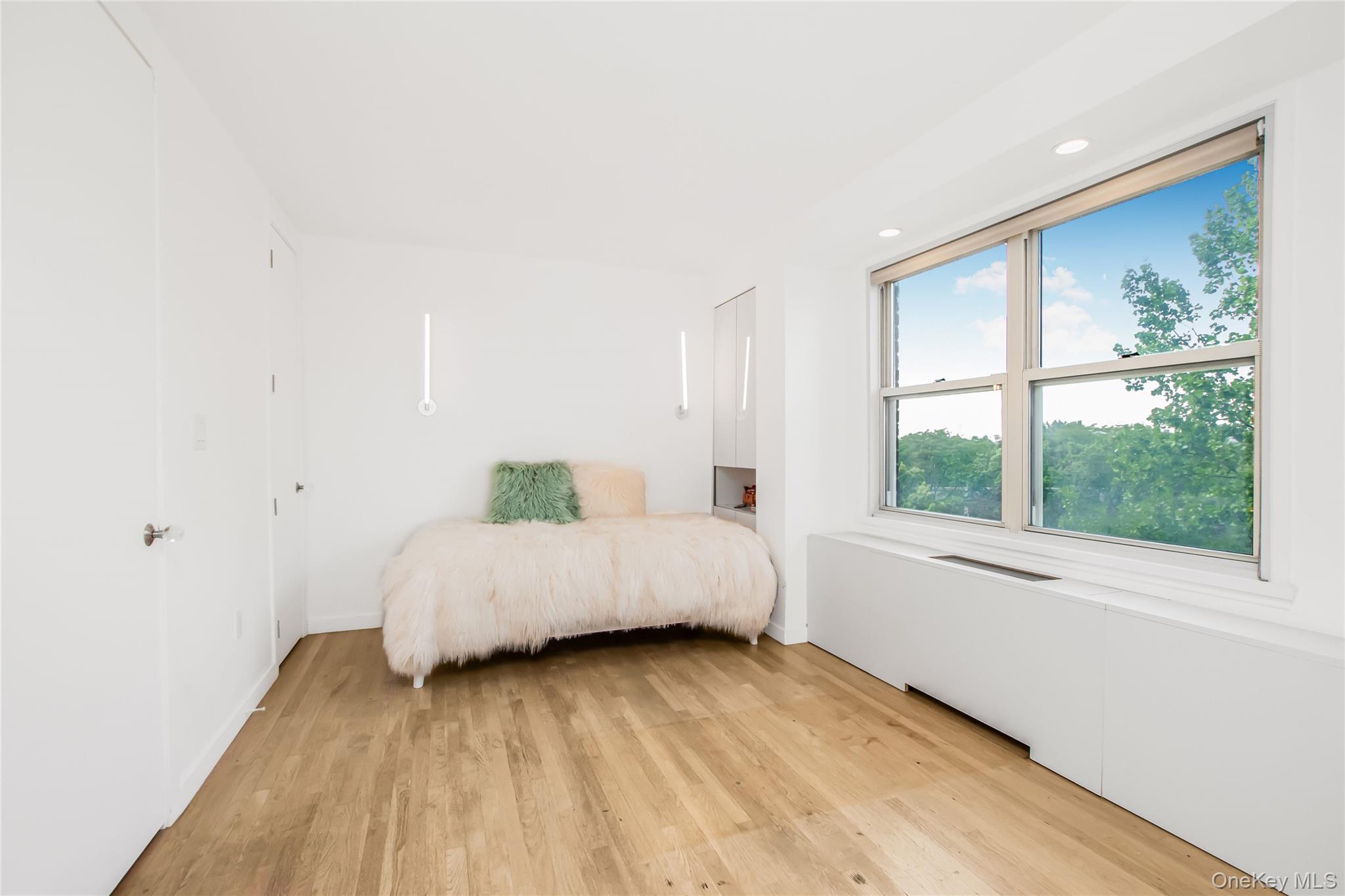 3777 Independence Avenue, Unit 7H Bronx, NY 10463 - Photo 16 of 26 a spacious bedroom with a bed and a large window