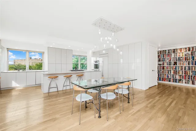 a dining room with furniture and wooden floor