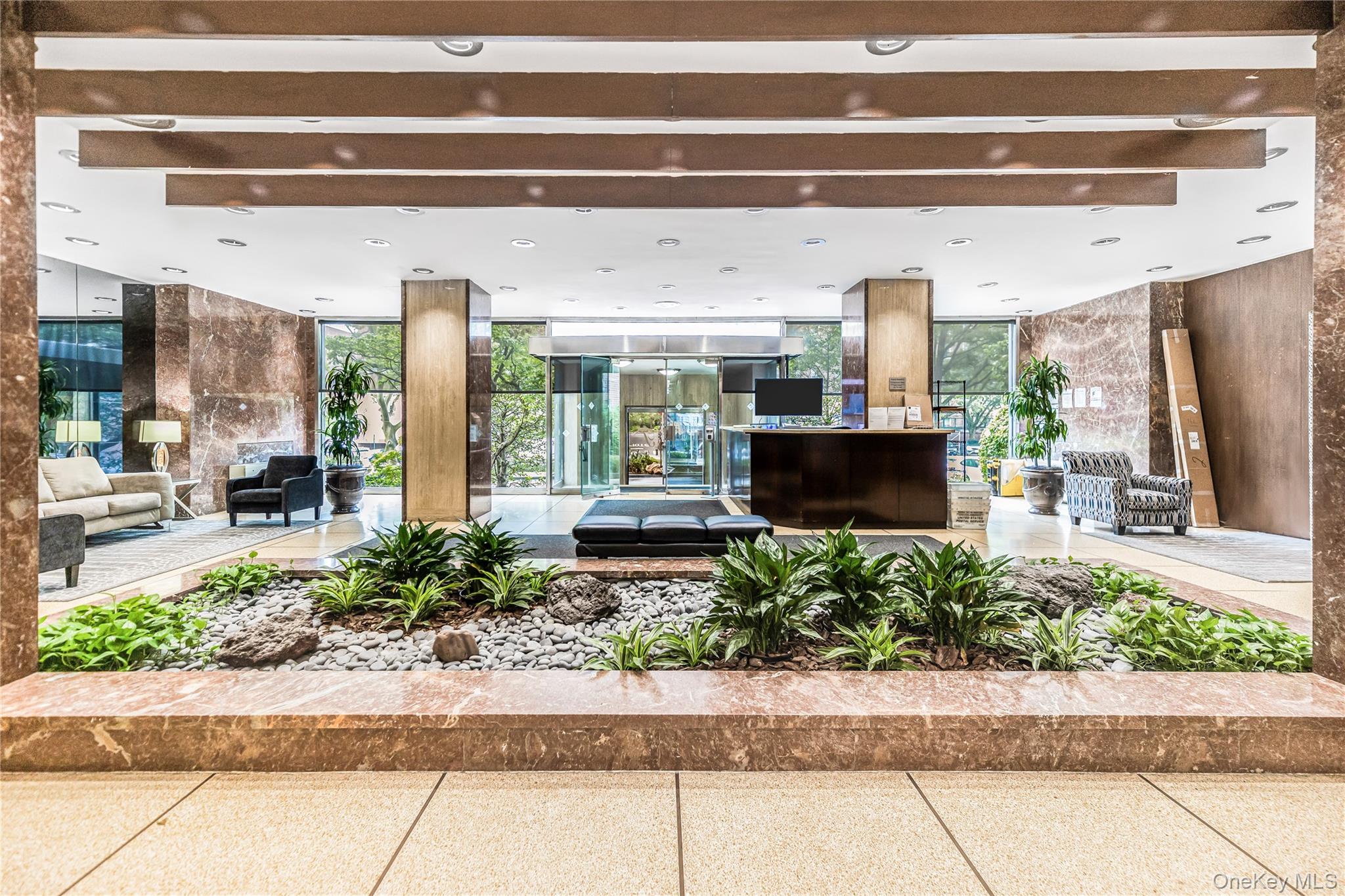 3777 Independence Avenue, Unit 7H Bronx, NY 10463 - Photo 23 of 26 a view of a building with a potted plant and a large window