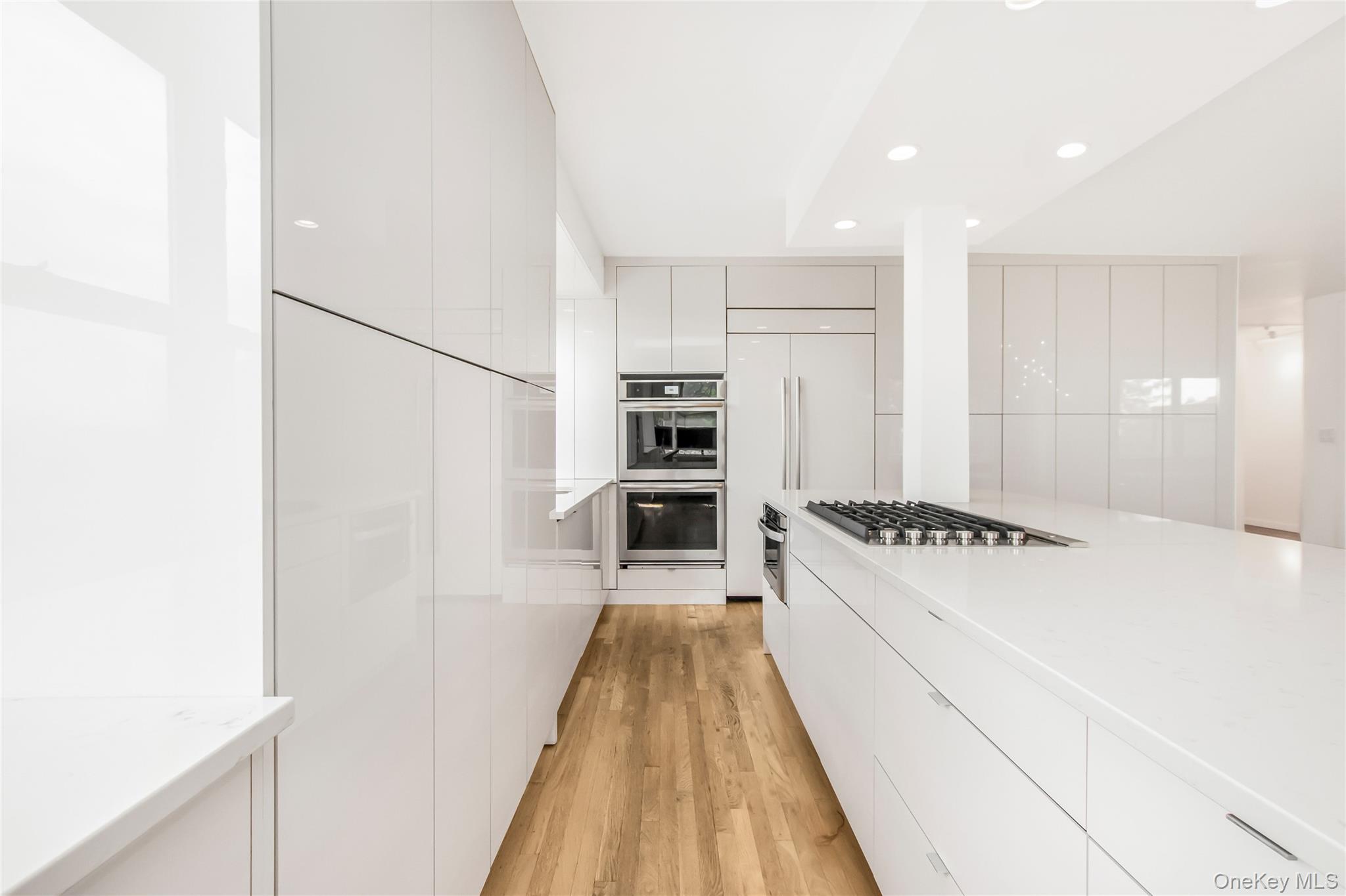 3777 Independence Avenue, Unit 7H Bronx, NY 10463 - Photo 5 of 26 a kitchen with stainless steel appliances a refrigerator and a stove top oven