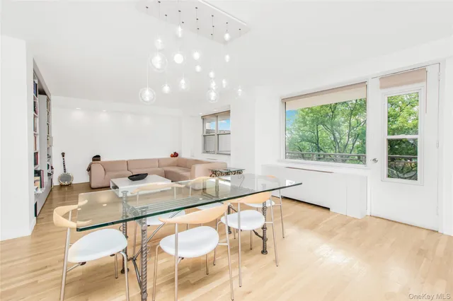 a dining hall with stainless steel appliances granite countertop a granite counter tops a sink and a window