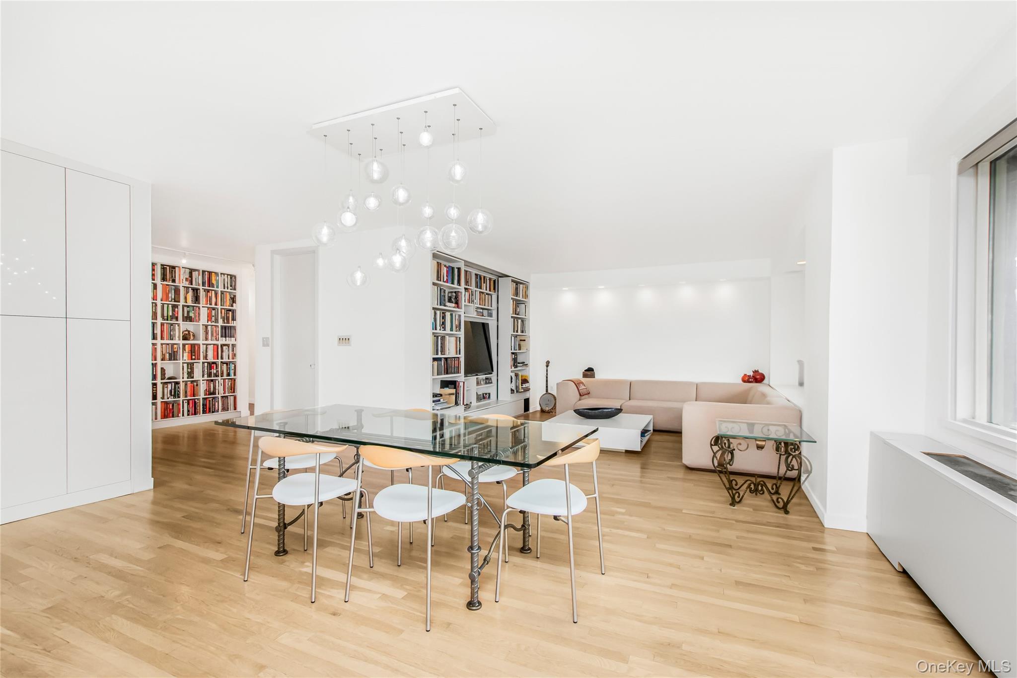 3777 Independence Avenue, Unit 7H Bronx, NY 10463 - Photo 8 of 26 a living room with furniture and a table