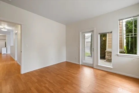 a bathroom with a tub double sink and mirror
