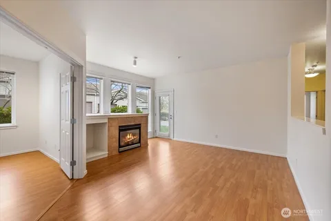 a view of a kitchen with a refrigerator and a window