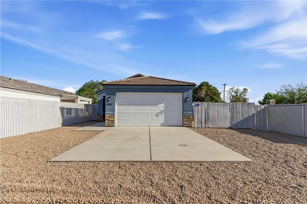 a front view of a house with a garage