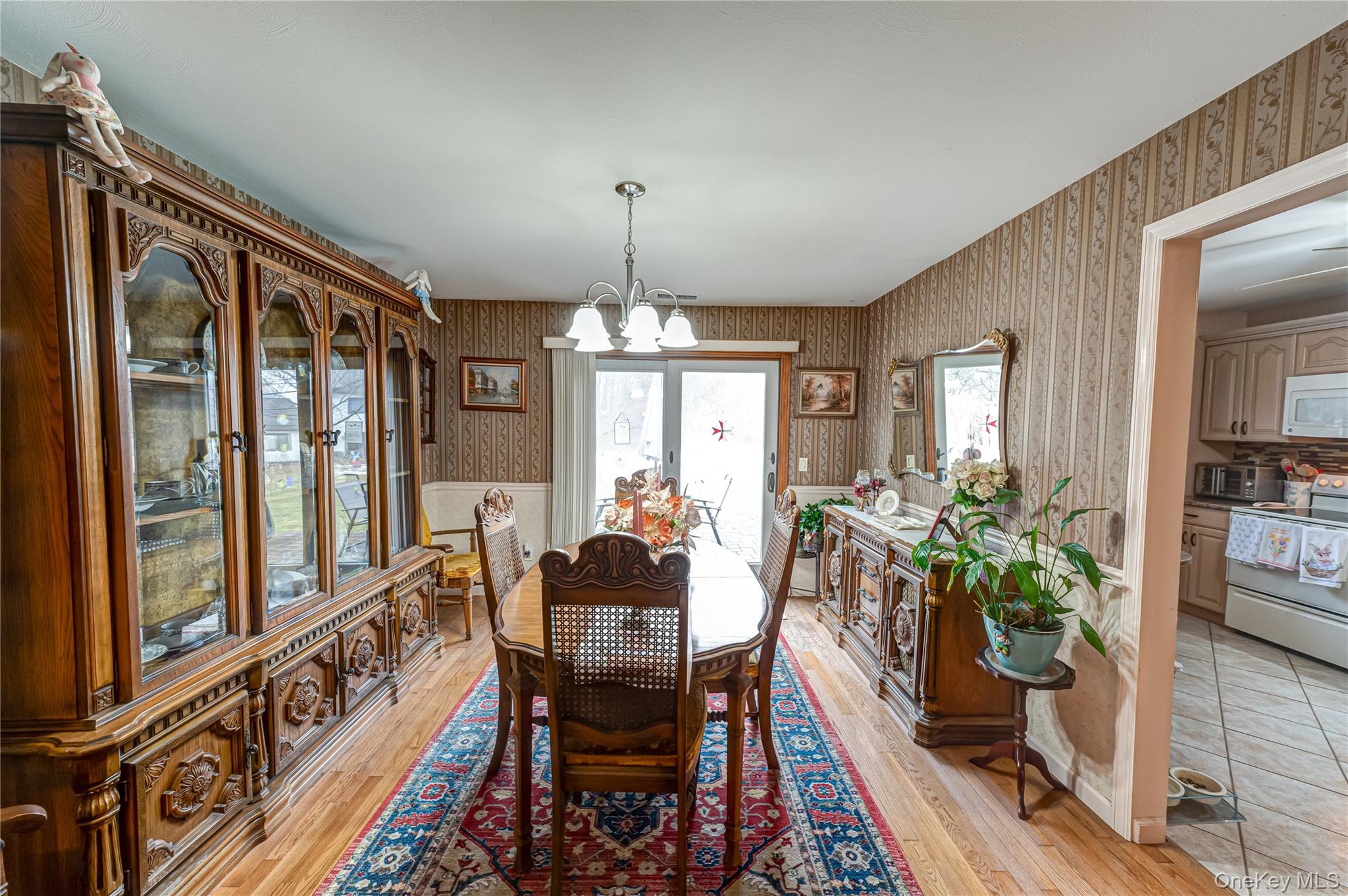12 Blue Point Road East, Unit 12 Holtsville, NY 11742 - Photo 12 of 20 a view of a dining room with furniture window and wooden floor