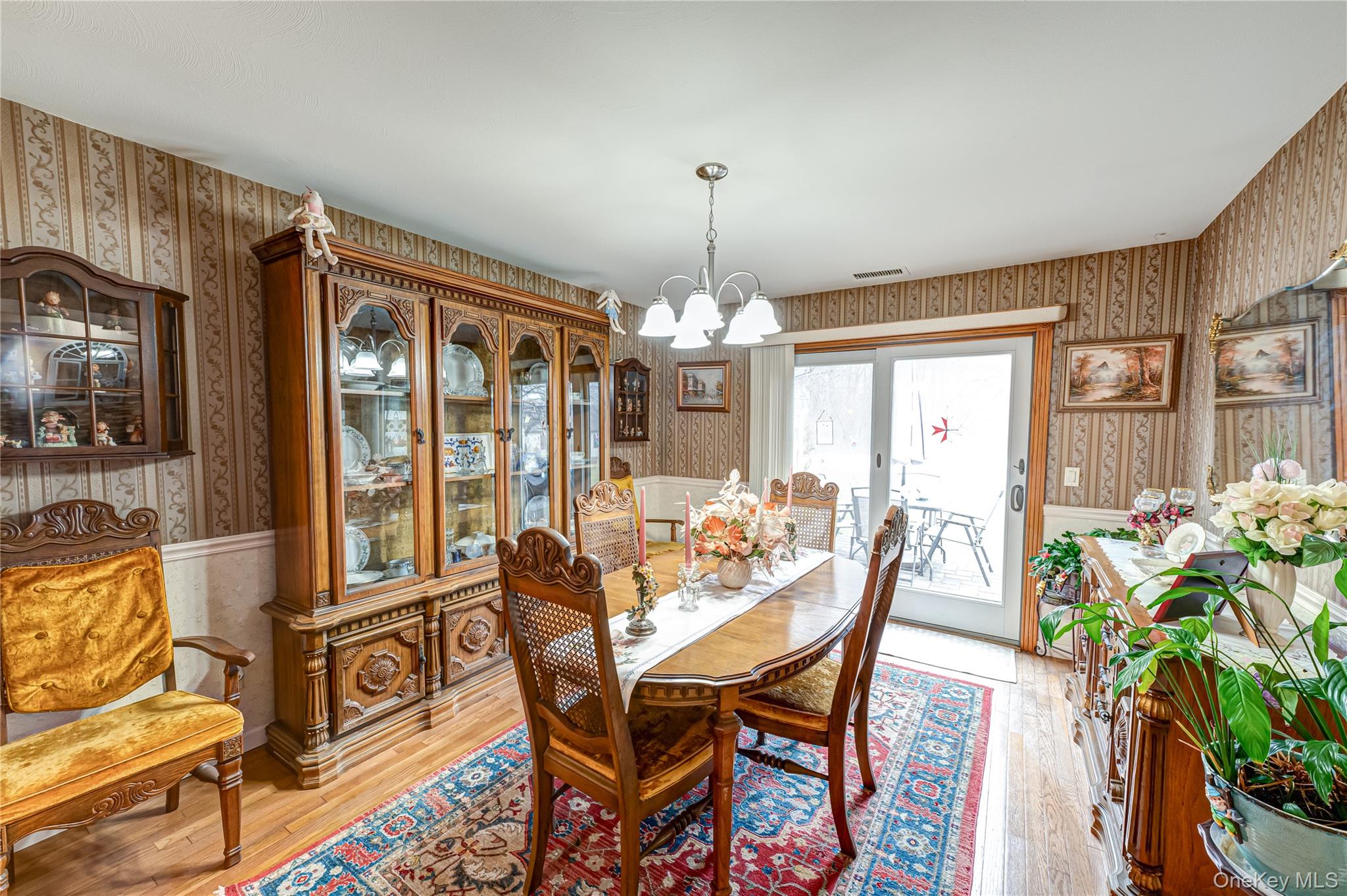12 Blue Point Road East, Unit 12 Holtsville, NY 11742 - Photo 13 of 20 a view of a dining room with furniture window and wooden floor